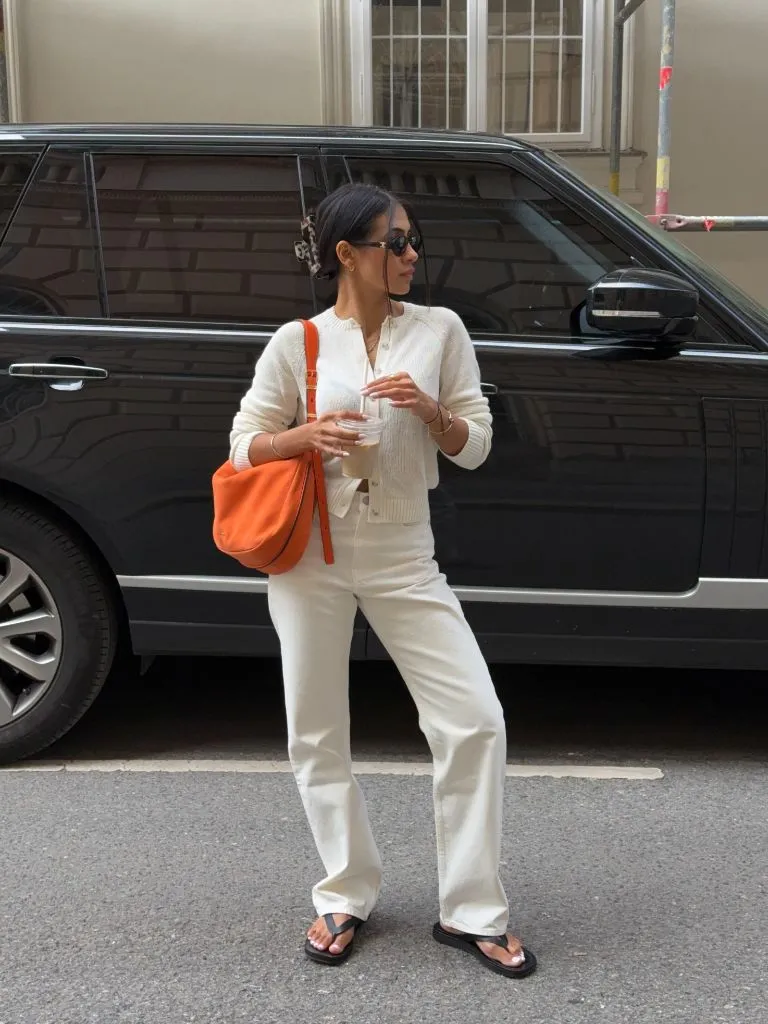 All-cream outfit with orange bag