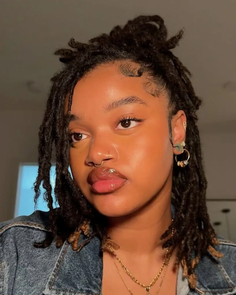 Locs Hairstyles for Black Women Curly Distressed Locs With Face-Framing Wisps