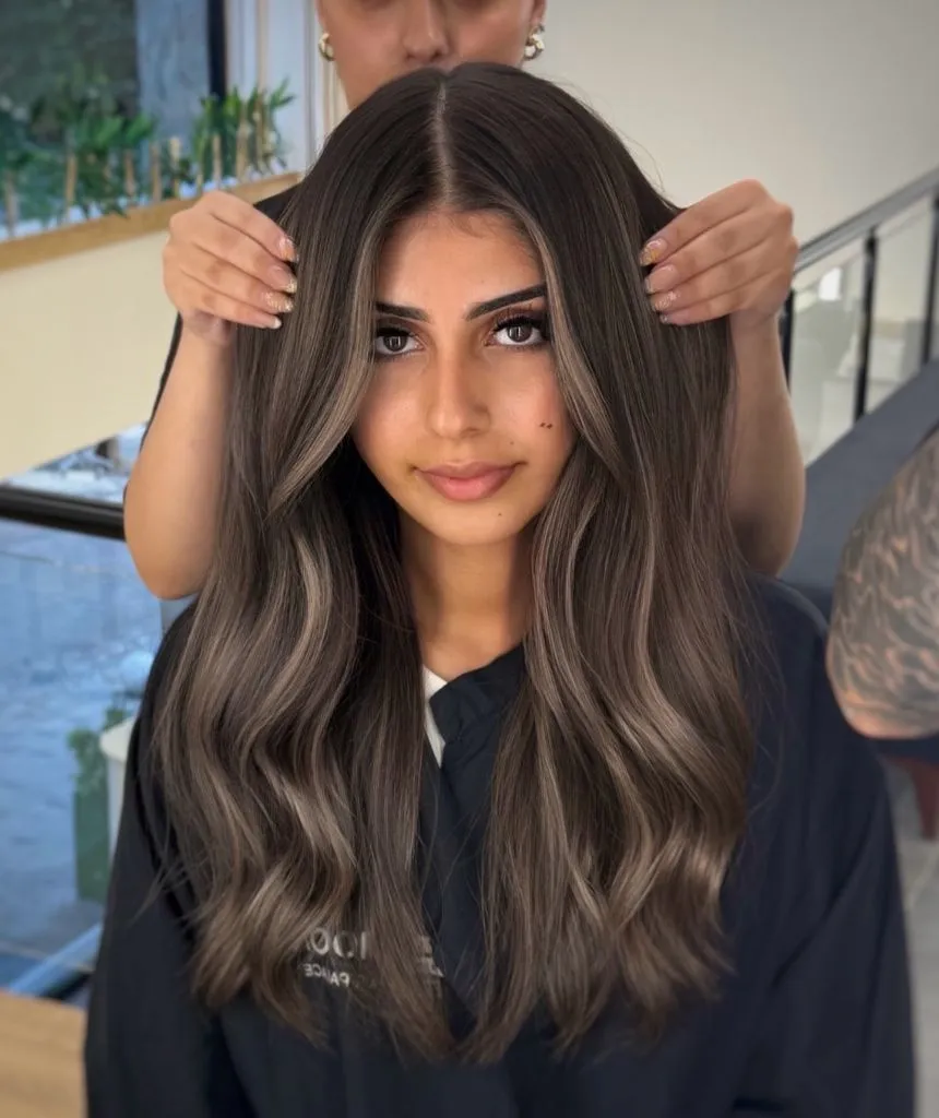 Ash-toned brunette balayage with dimensional waves