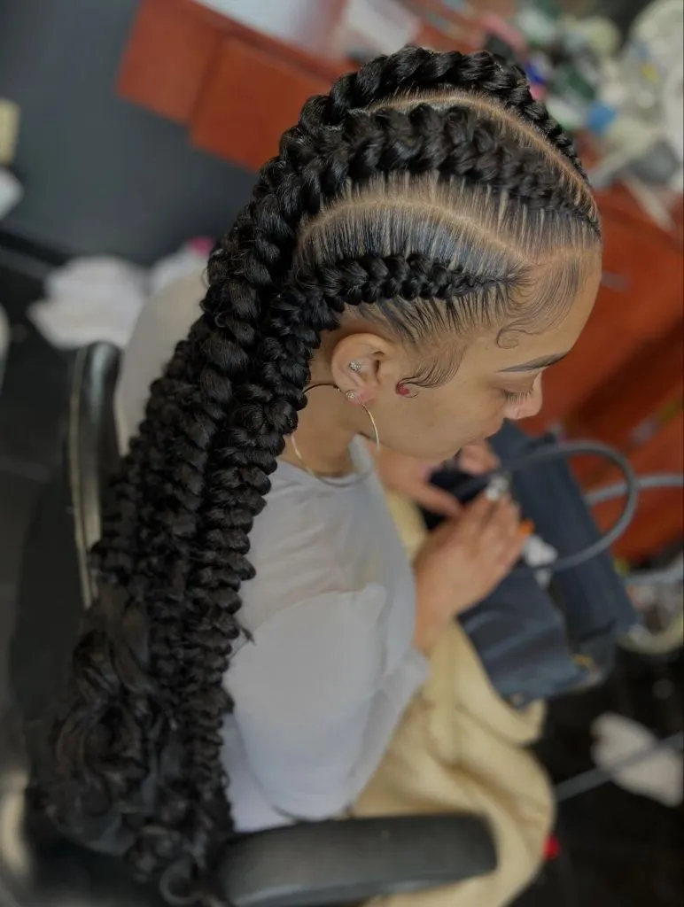 Butterfly Braids Hairstyle Thick Feed-In Ponytail Braids with Stitch Detail and Curly Finish