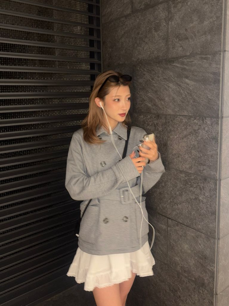 Grey belted short peacoat with white ruffled mini skirt