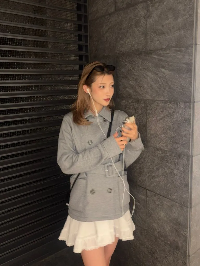 Grey belted short peacoat with white ruffled mini skirt
