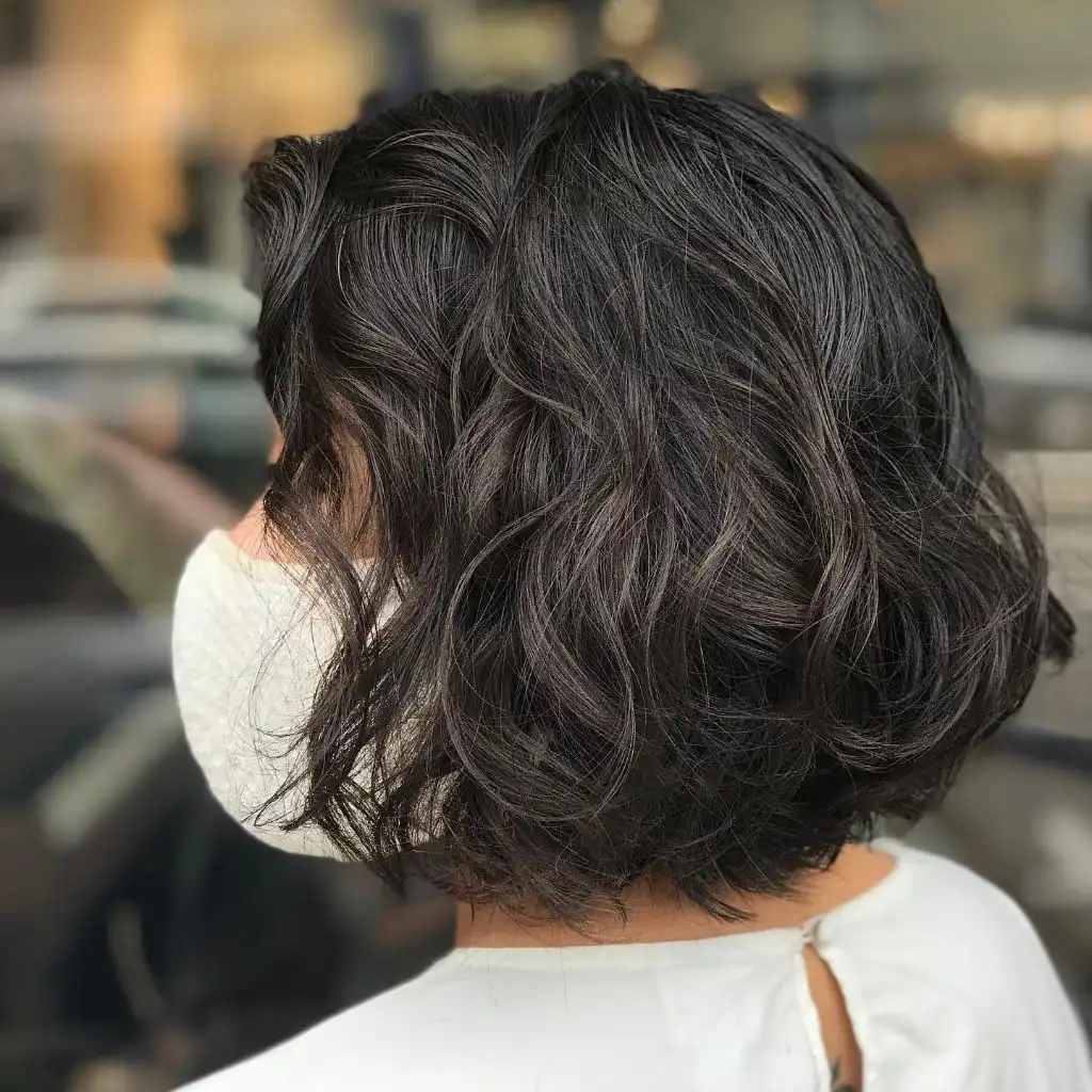 Bobbed Haircut for Women Voluminous Dark Waves with an Airy Rounded Silhouette