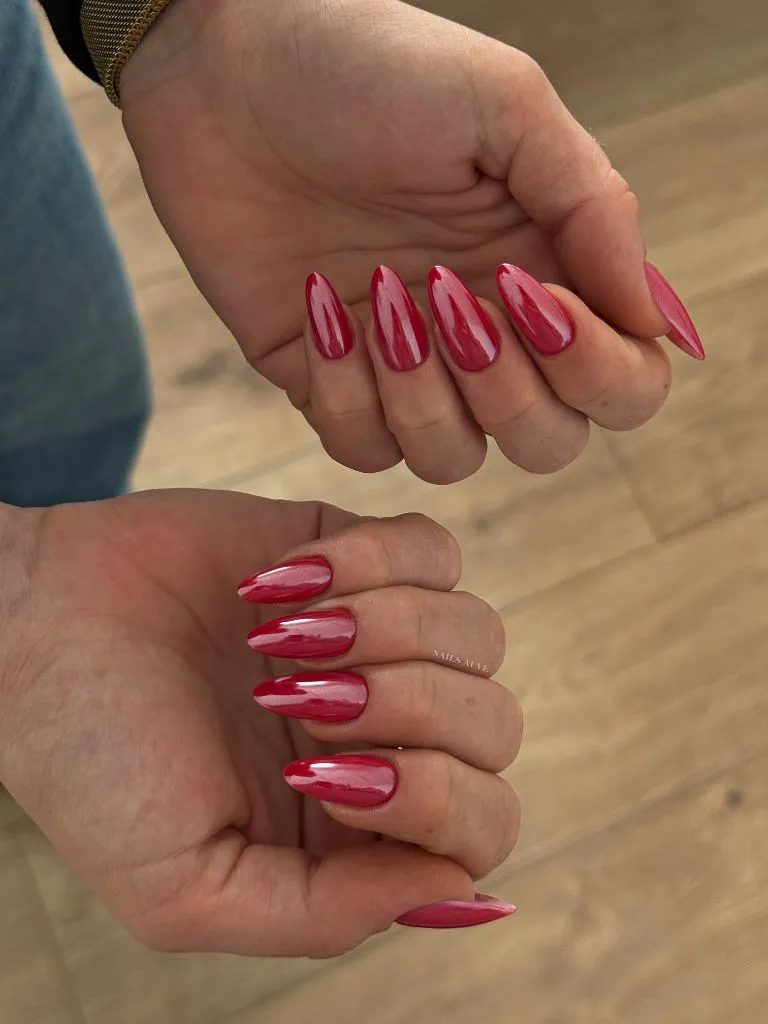 Velvet cherry red chrome nails with liquid glass finish on almond nails August nails color 2026 ideas