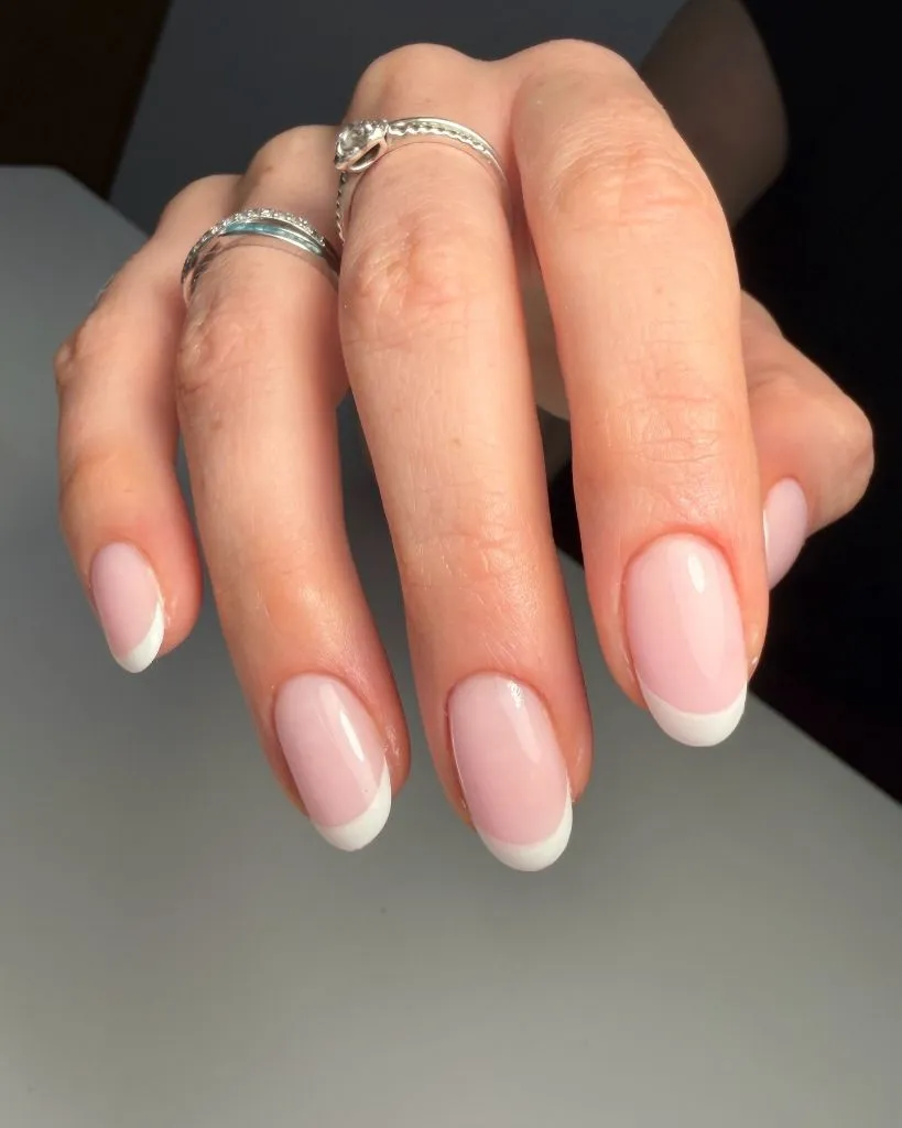 Classic white French tip on almond shaped nails August nails color 2026 ideas