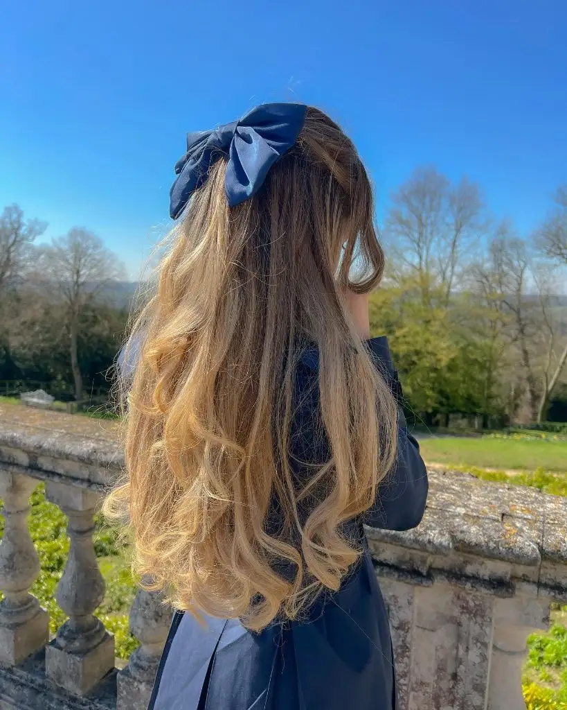 Fall Hairstyles for Long Hair 2026 Golden Blonde Half-Up With Satin Navy Bow