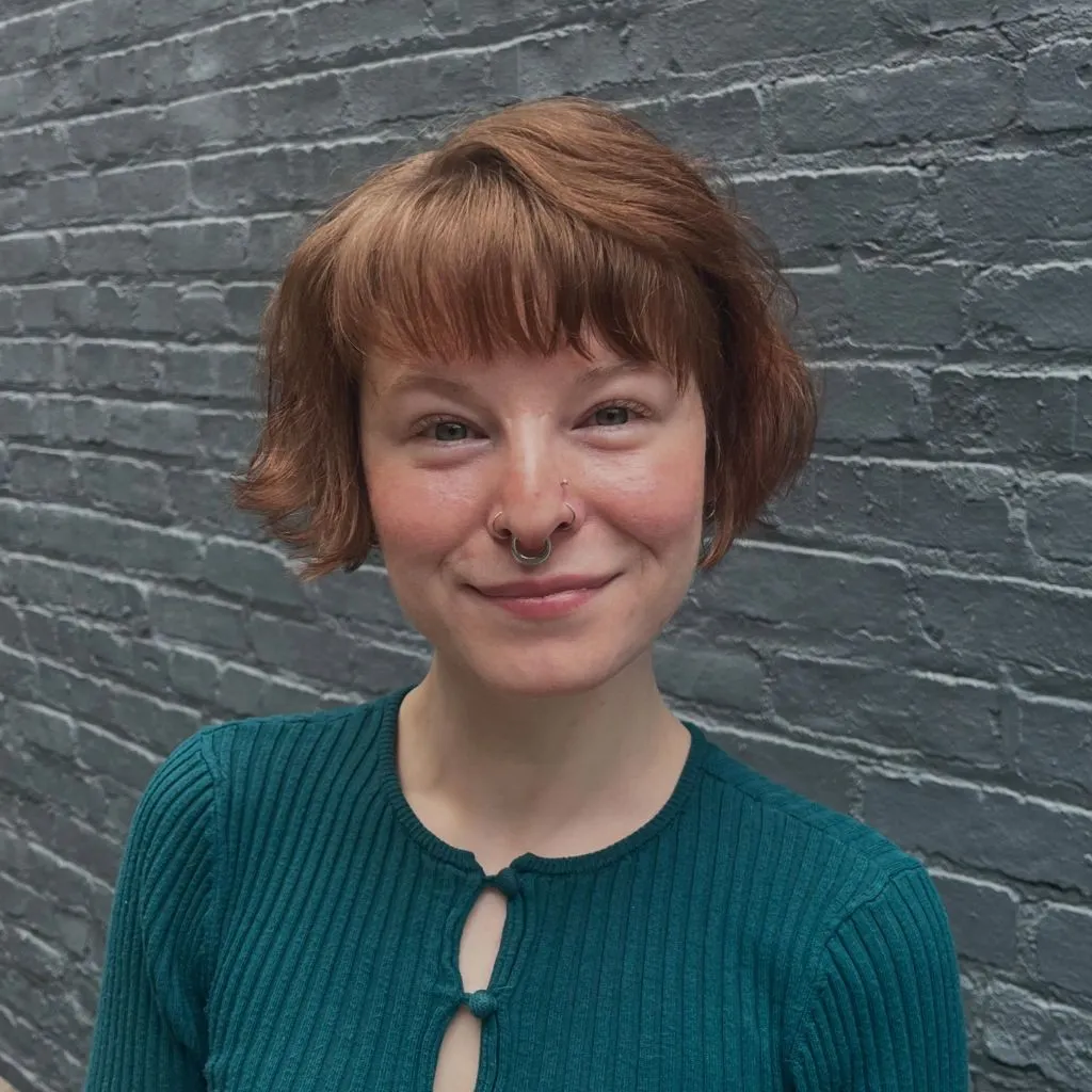 Bobbed Haircut for Women Copper-Kissed Cropped Bob with Feathered Baby Bangs