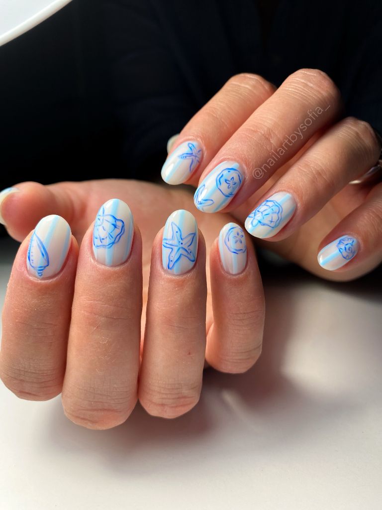 Coastal blue line art nails with seashell sketches, beach inspired August nails 2026