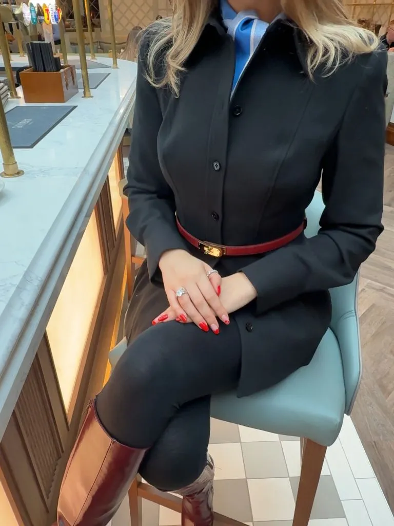 Fall professional outfit black button-down with Hermès belt and knee boots