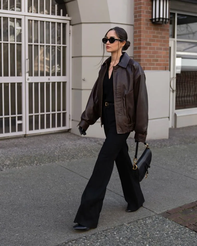 Brown leather bomber with black outfit