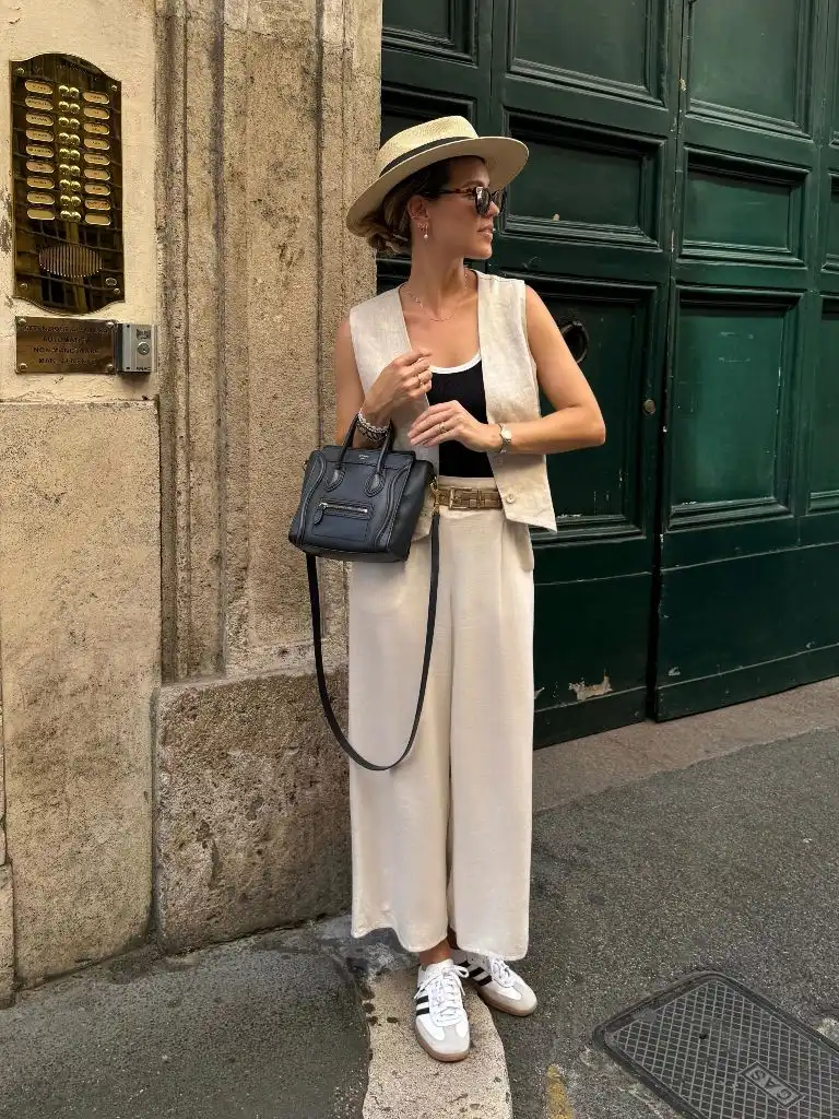 Cream linen vest and wide-leg pants with straw hat and Céline bag
