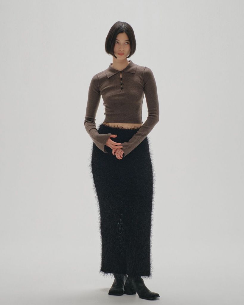 Black fuzzy knit midi skirt with brown collared knit top and boots