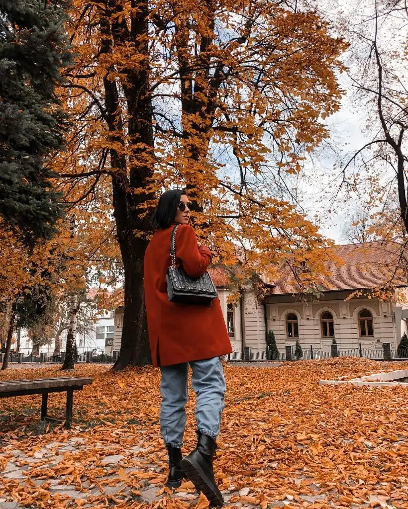 Red-orange blazer with autumn leaves