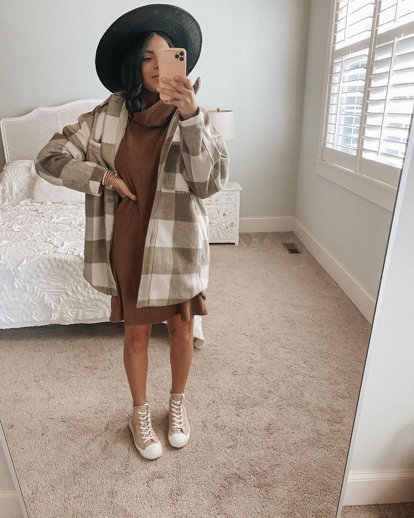 Mirror selfie in checked shacket over brown sweater dress