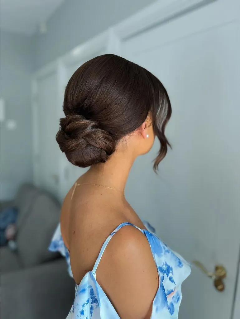 Fall Hairstyles for Office 2026 Sleek Low Chignon with Face-Framing Tendrils