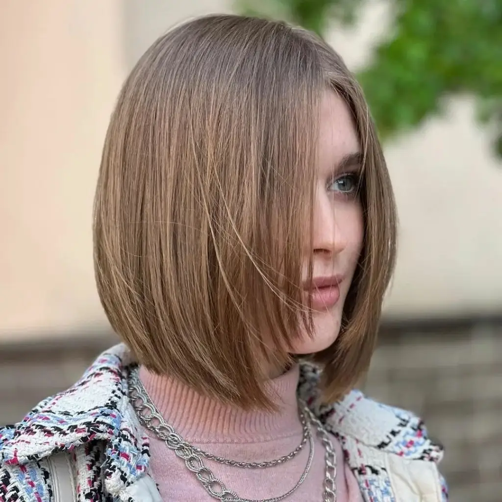 Bobbed Haircut for Women Light Bronde Bob with Soft Center Part and Natural Movement