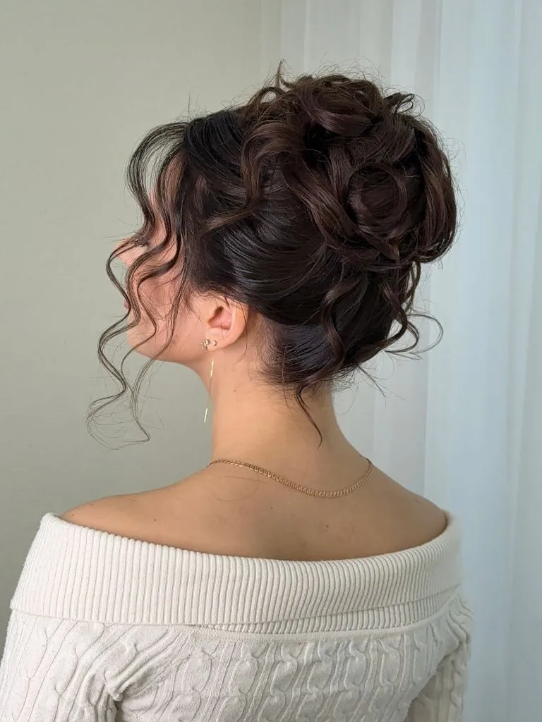 Fall Hairstyles for Wedding Guests 2026 Curly Textured High Messy Bun