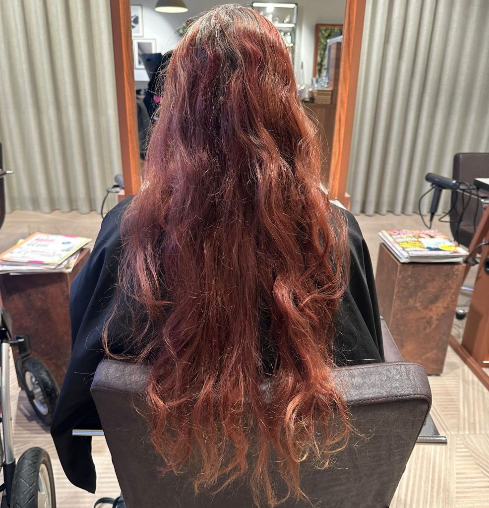 Fall Haircuts for Women 2026 Deep Auburn Waves with Burgundy Dimension and Length