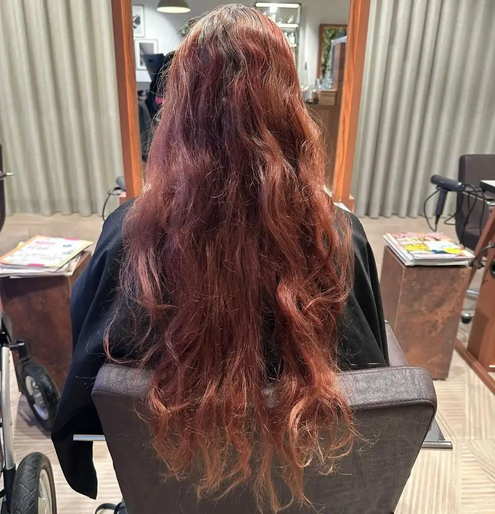 Fall Haircuts for Women 2026 Deep Auburn Waves with Burgundy Dimension and Length