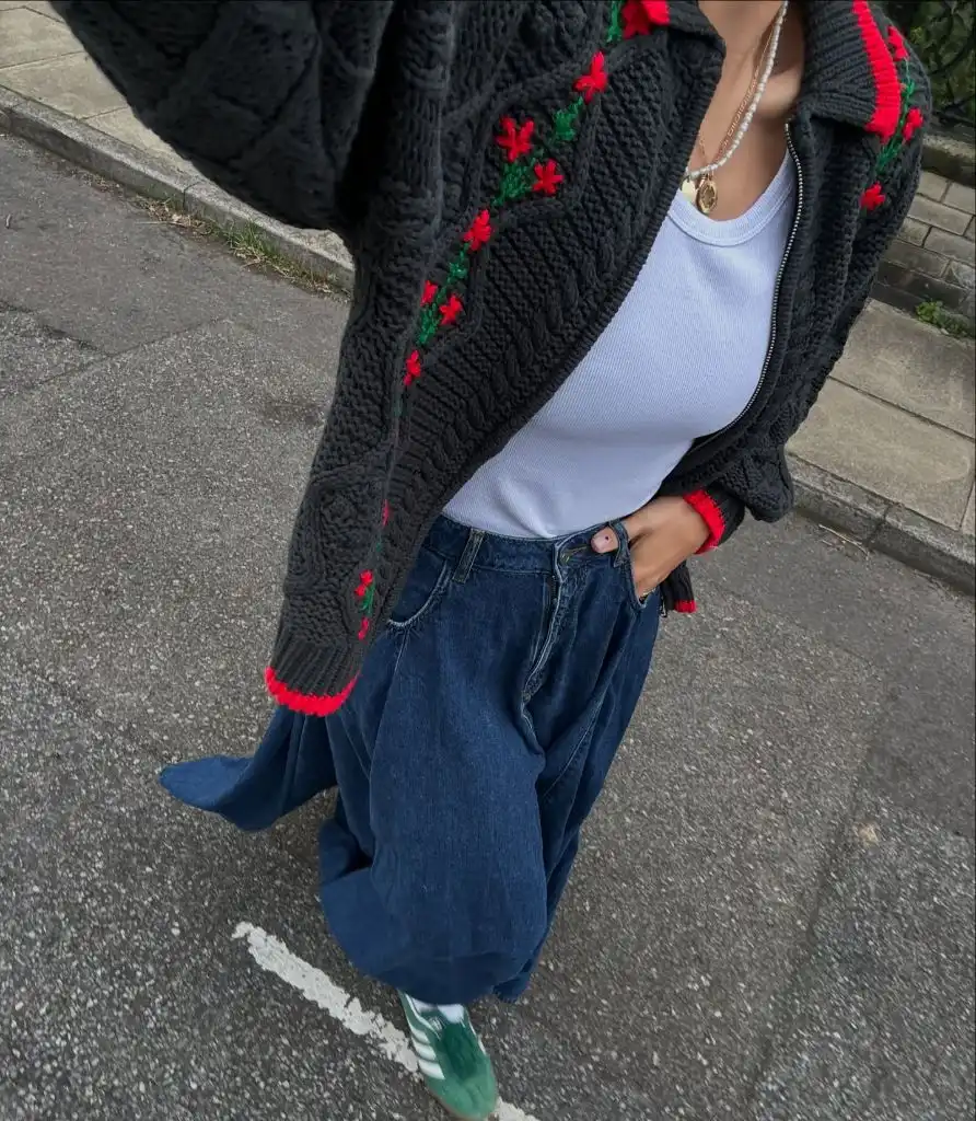 Fall professional outfit black embroidered knit cardigan white tank baggy jeans green sneakers