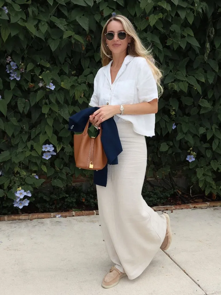 White linen button-down with cream maxi skirt and tan loafers