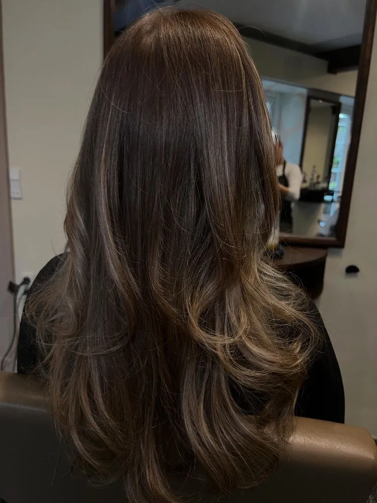 Fall Haircuts for Women 2026 Glossy Chocolate Balayage with Soft Curled Ends