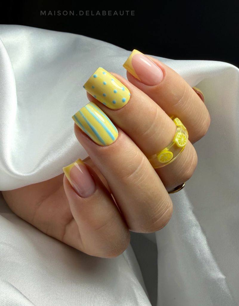 Lemon print square nails with yellow and blue details, a fun August nails idea 2026