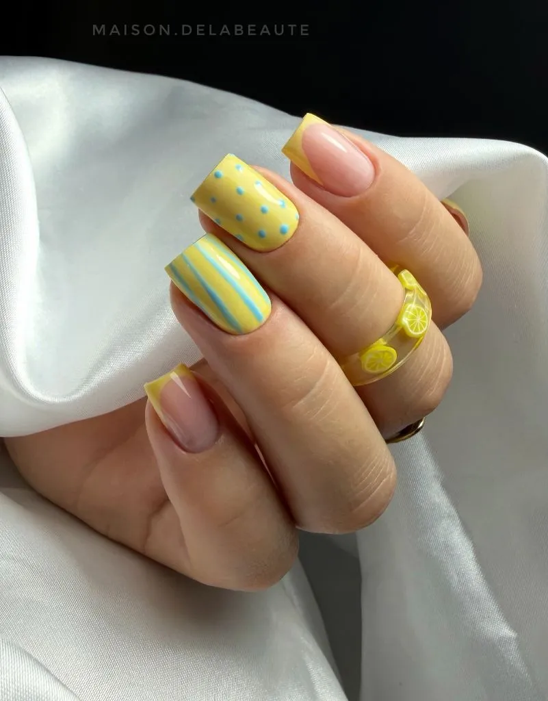 Lemon print square nails with yellow and blue details, a fun August nails idea 2026