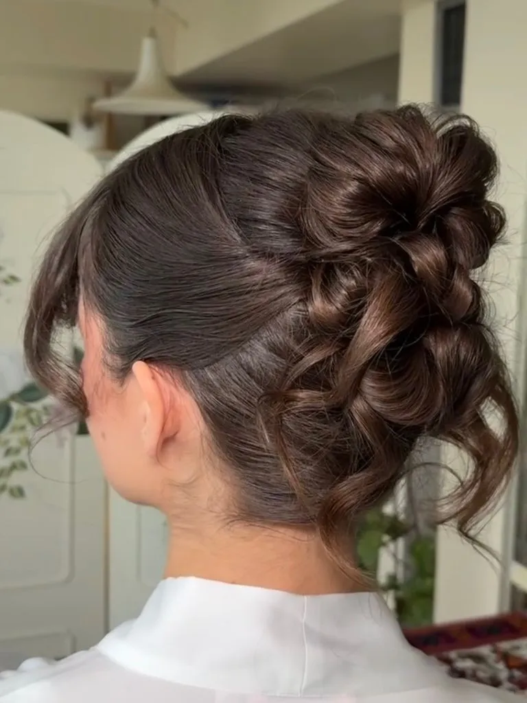 Fall Hairstyles for Wedding Guests 2026 Curly French Twist with Cascading Texture