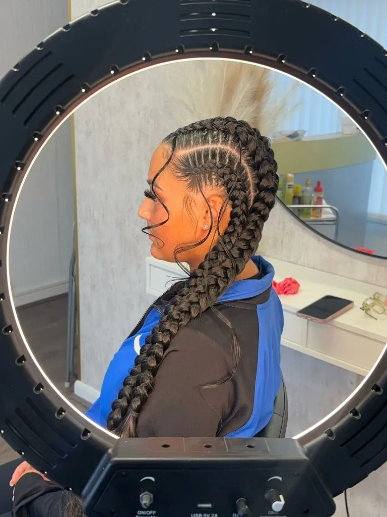 Butterfly Braids Hairstyle Two Oversized Stitch Braids with Center Part and Long Length