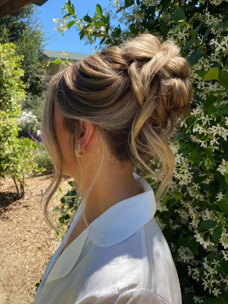 Fall Hairstyles for Wedding Guests 2026 Effortless Textured High Bun with Volume