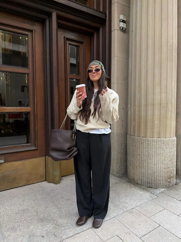 Beige sweatshirt and black trousers