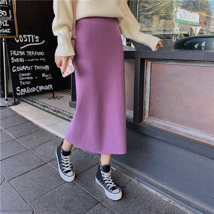 Purple knit midi skirt with cream oversized sweater and black Converse