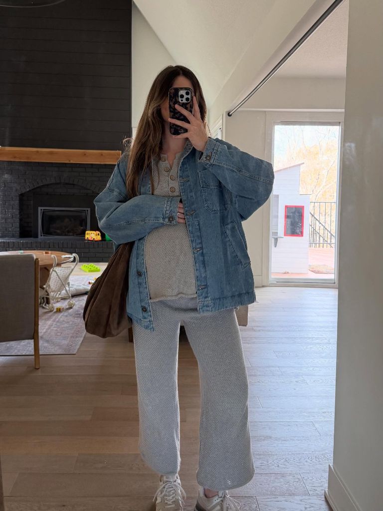 Mirror selfie in oversized denim jacket over knit set