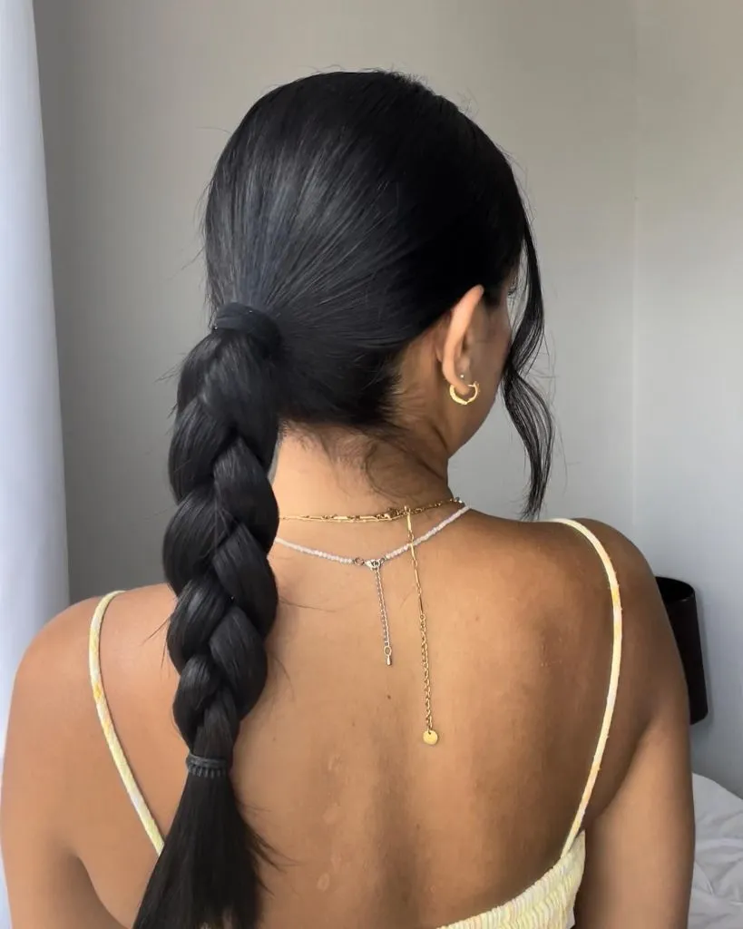 Fall Hairstyles for Long Hair 2026 Classic Low Ponytail Braid in Deep Midnight Black
