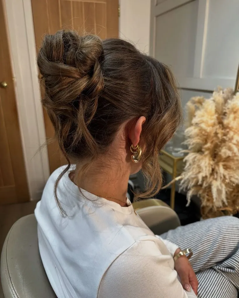 Fall Hairstyles for Office 2026 Textured Braided High Bun with Face-Framing Wisps