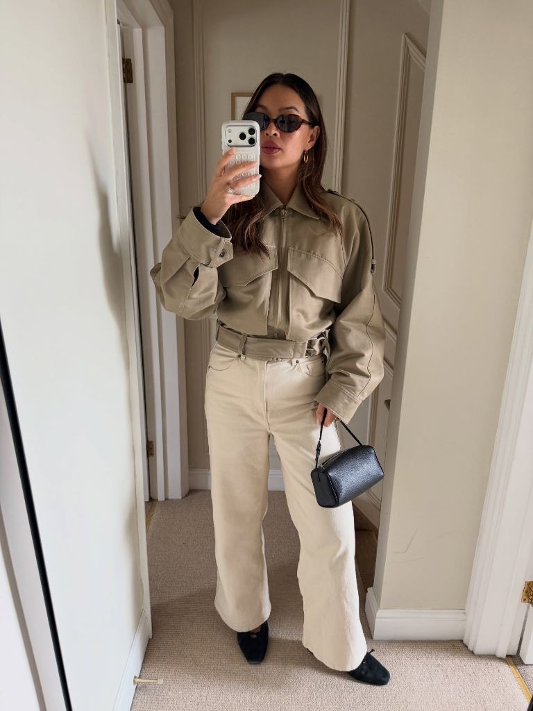 Olive green utility style jacket with cream wide leg pants