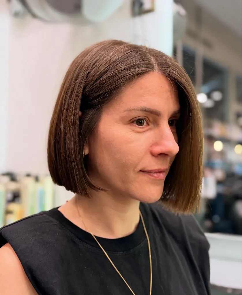 Bobbed Haircut for Women Sleek Brunette Blunt Bob at Jaw Length