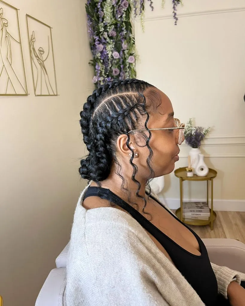 Butterfly Braids Hairstyle Cornrow-to-Bun Updo with Wavy Face-Framing Pieces