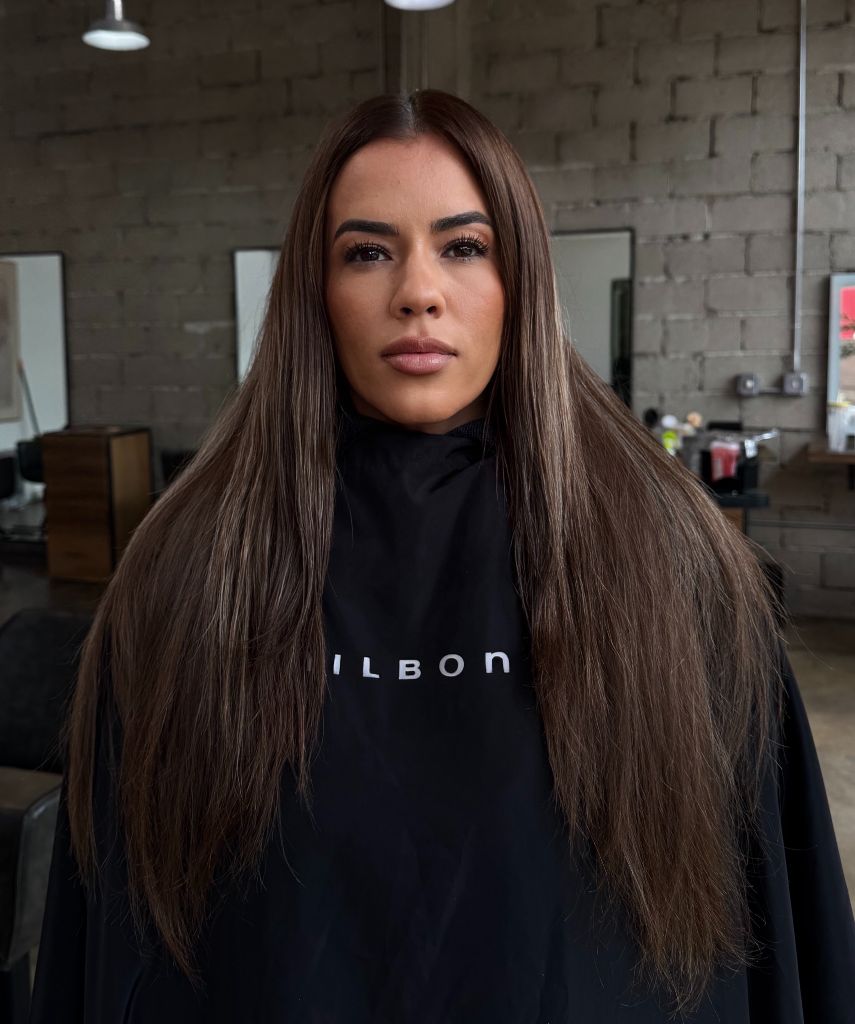 Fall Haircuts for Women 2026 Sleek Chestnut Layers with a Center-Part Curtain Fall