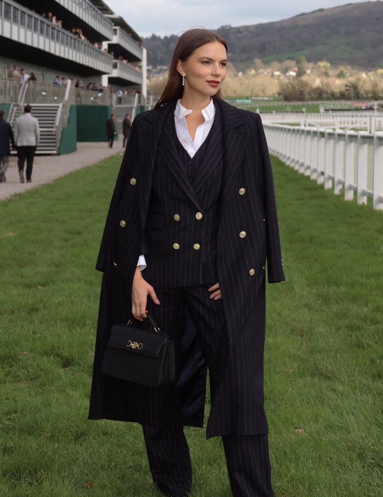 Fall professional outfit pinstripe suit with gold buttons and structured bag