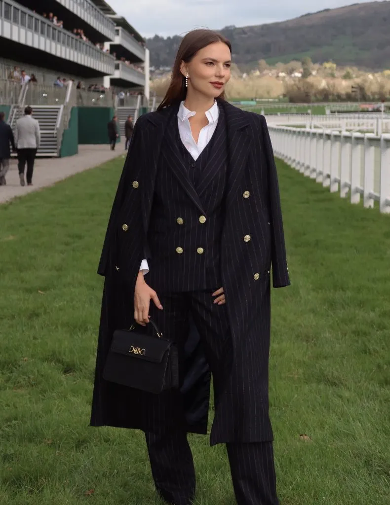 Fall professional outfit pinstripe suit with gold buttons and structured bag