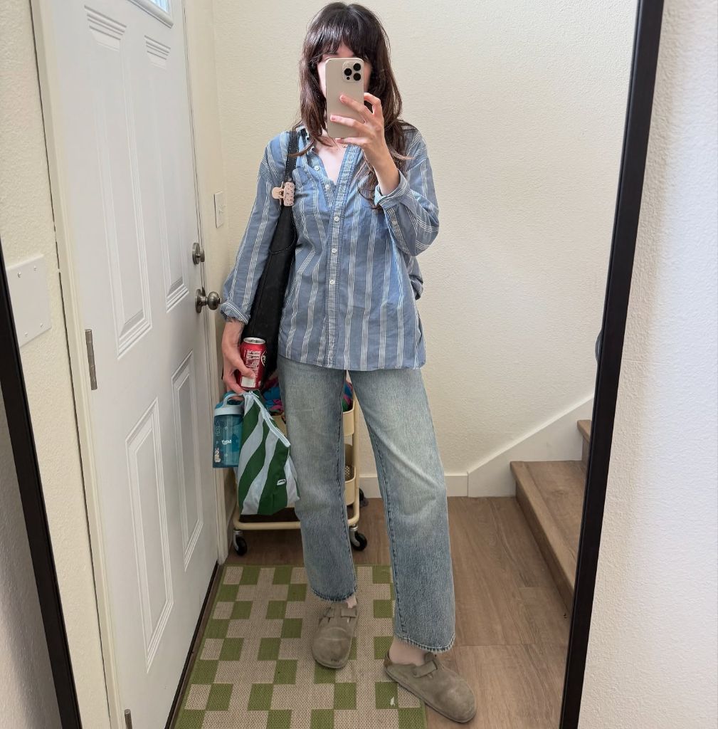 Mirror selfie in striped shirt and light wash jeans