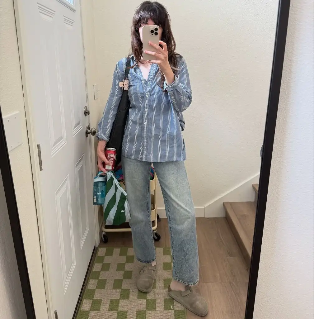 Mirror selfie in striped shirt and light wash jeans