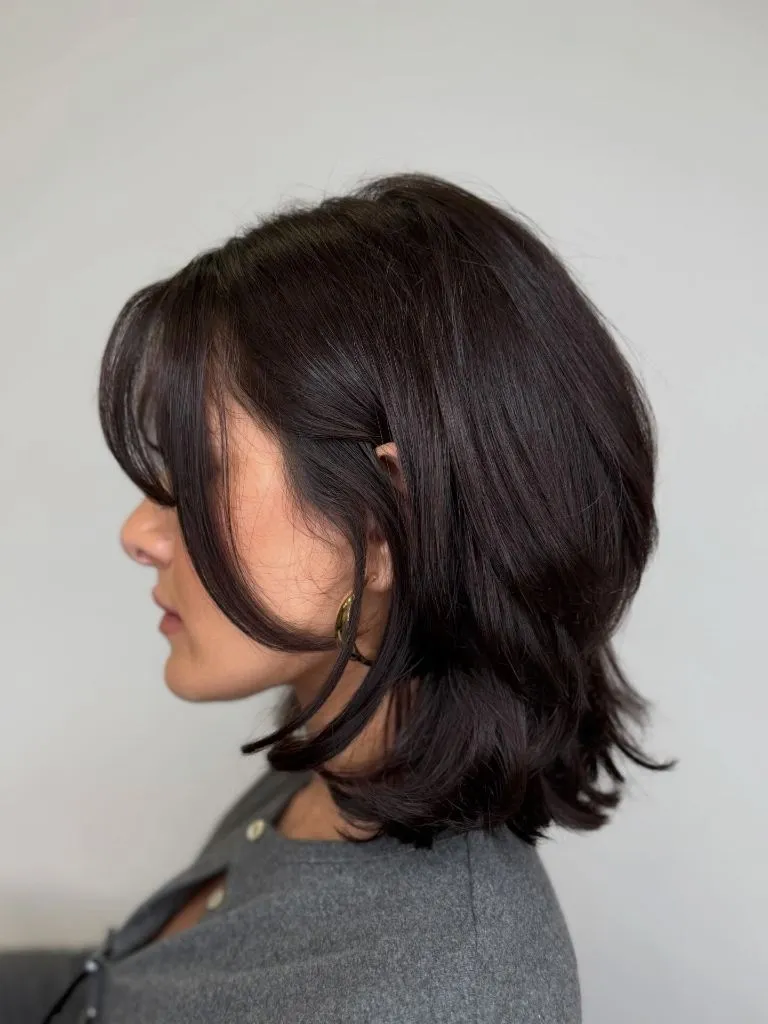 Fall hairstyles for short hair 2026 Layered Medium Bob with Face-Framing Curtain Pieces