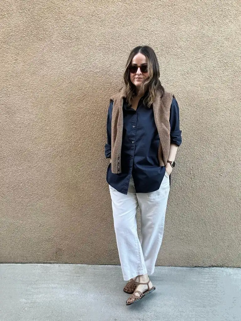 Fall professional outfit navy button-down camel sweater white pants brown sandals
