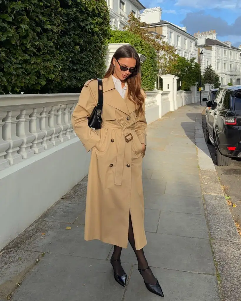 Fall professional outfit camel trench coat white shirt black tights pointed shoes London street