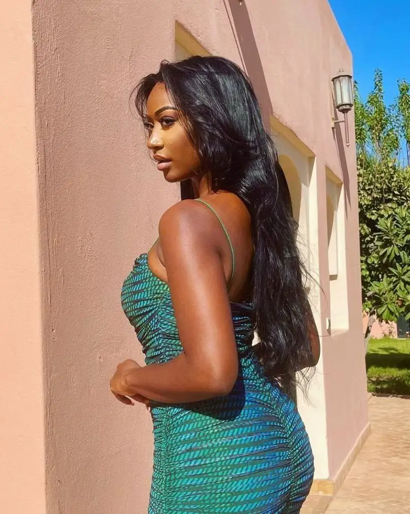 Fall Hair Colors for Black Women 2026 Teal-Kissed Turquoise Body-Con Glow With Deep Black Waves