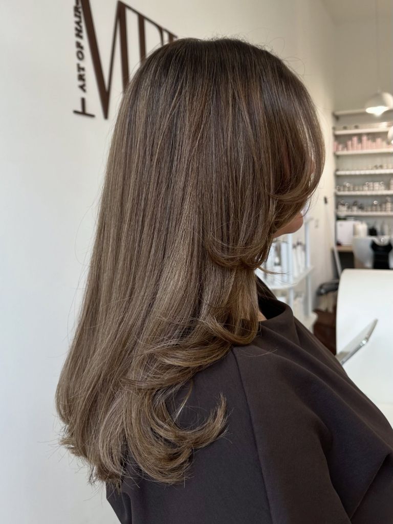 Fall Medium Haircuts 2026 Polished Ash Brunette with Bouncy Curled Ends