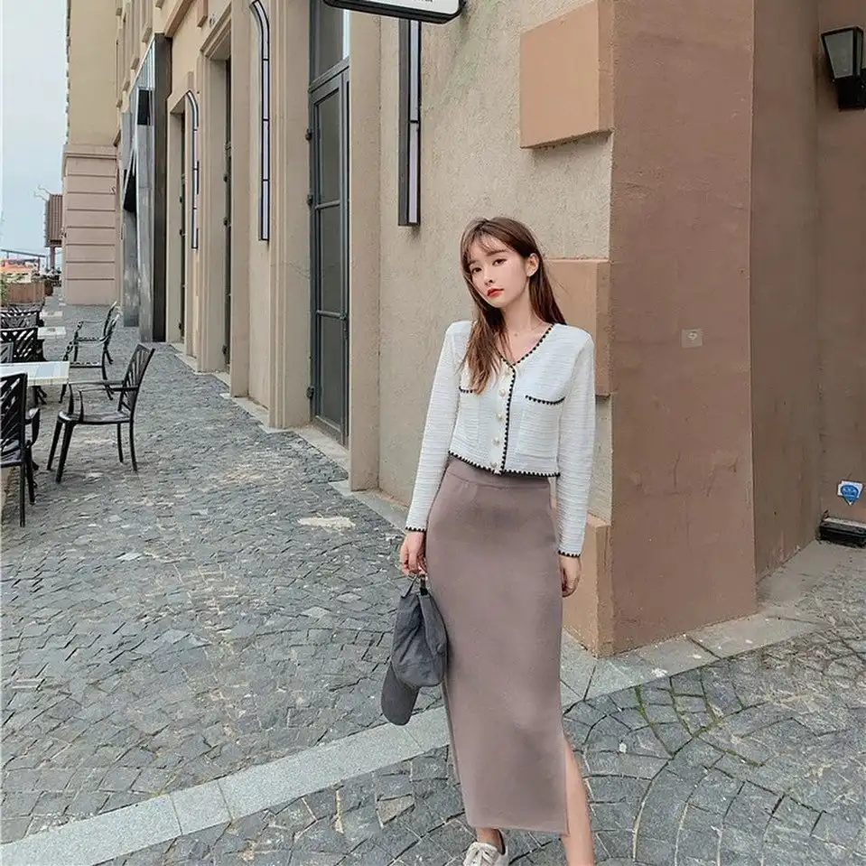 Cropped white tweed jacket with mauve knit midi skirt